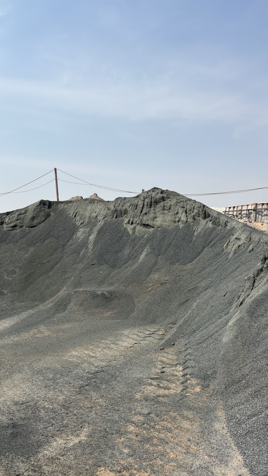 Black sand stockpile